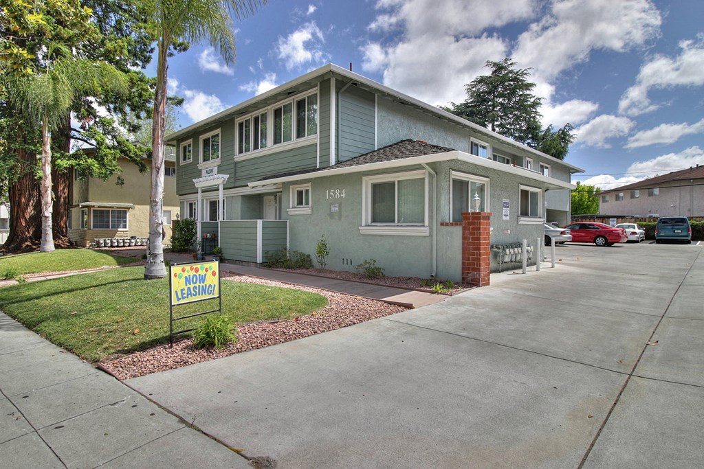 a house with a foreclosure sign in front of it