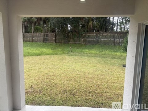 A view of a yard through a window.