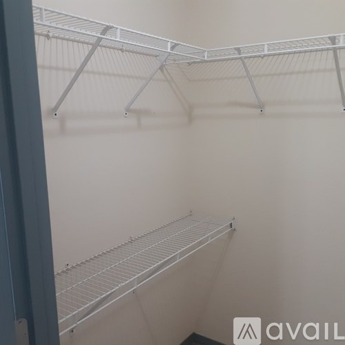 Empty shelves in a white room.