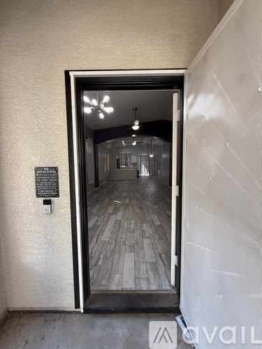 A doorway with a plaque on the wall that says "Please do not enter".