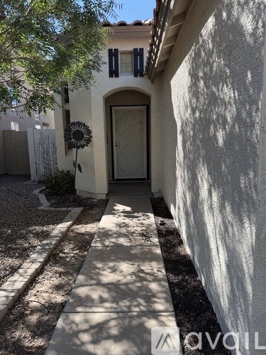 A white house with a door and window.