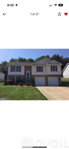 A two-story house with a garage is shown.