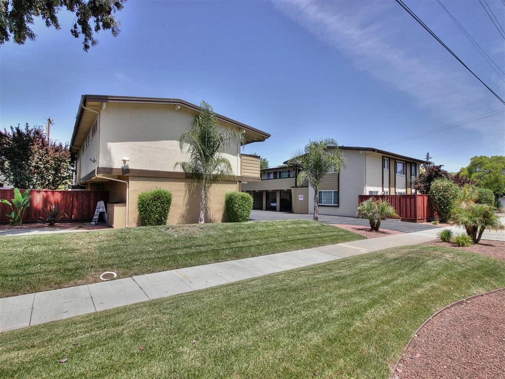a house with a yard and a sidewalk
