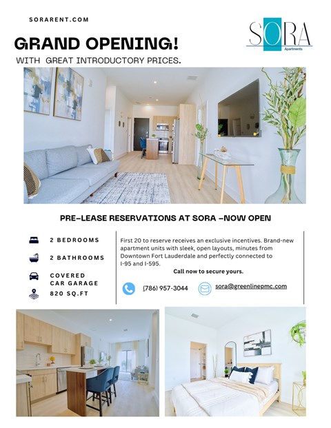 A white apartment building with green lawns in front.