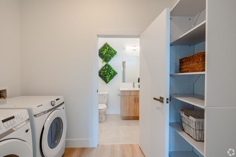 A laundry room with a washer and dryer.