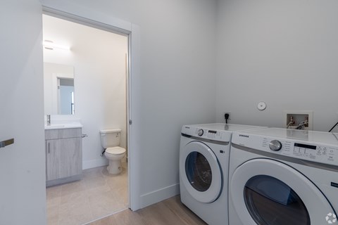 A laundry room with a washer and dryer.