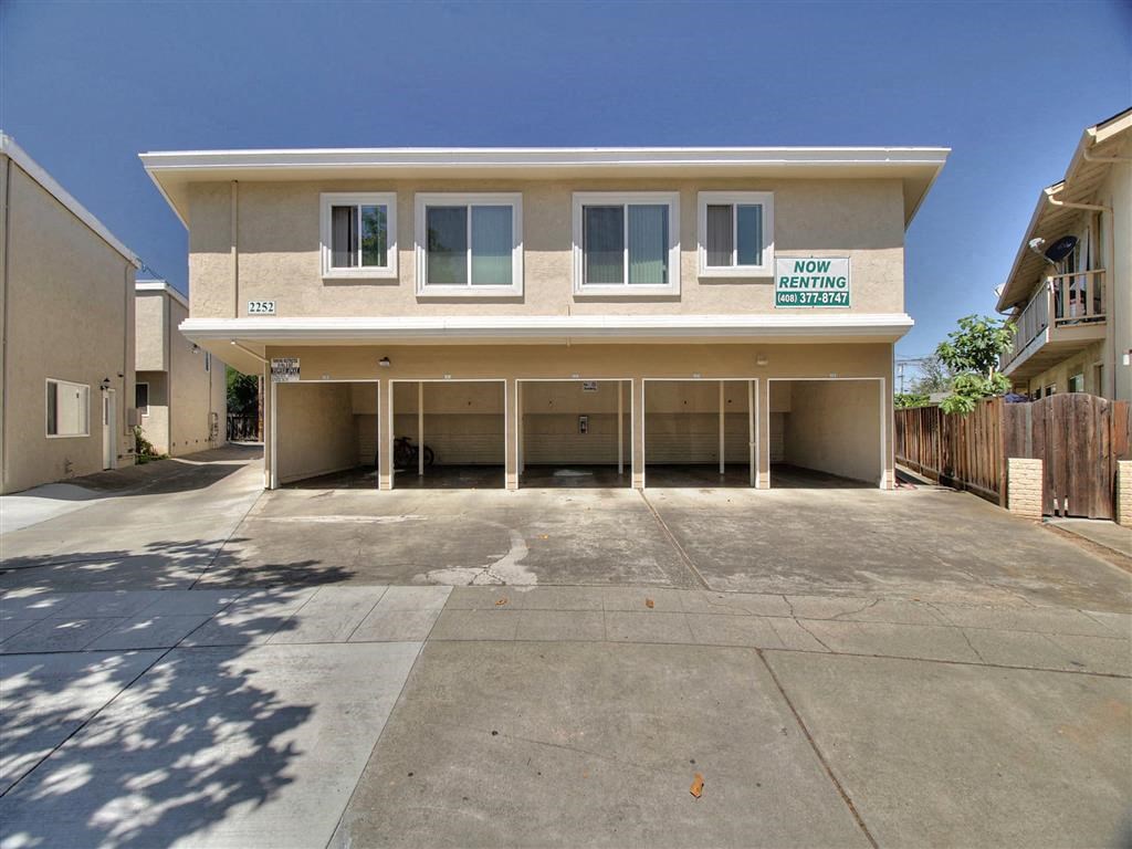 A two-story building with a sign that says
