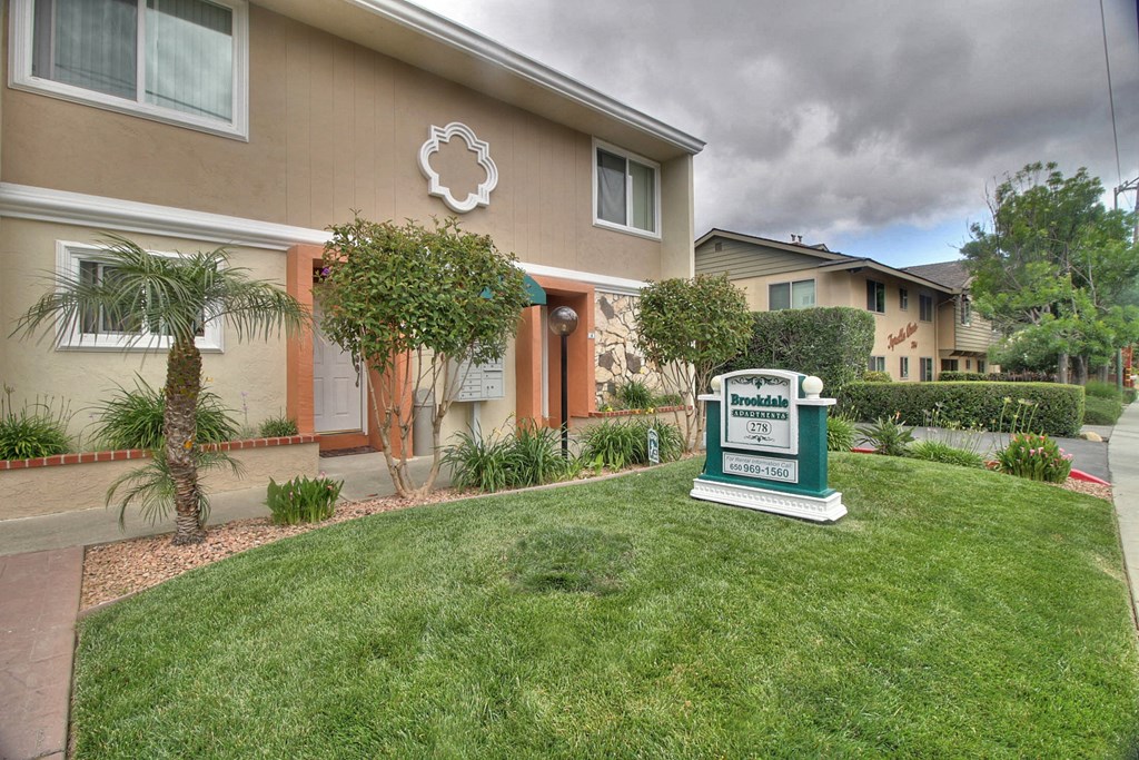 A sign in front of a house that says