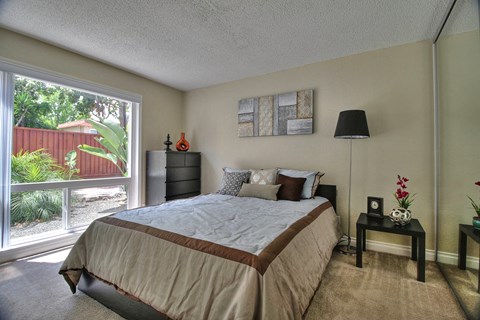 Bedroom with Floor to Ceiling Windows at Casa Alberta Apartments, California