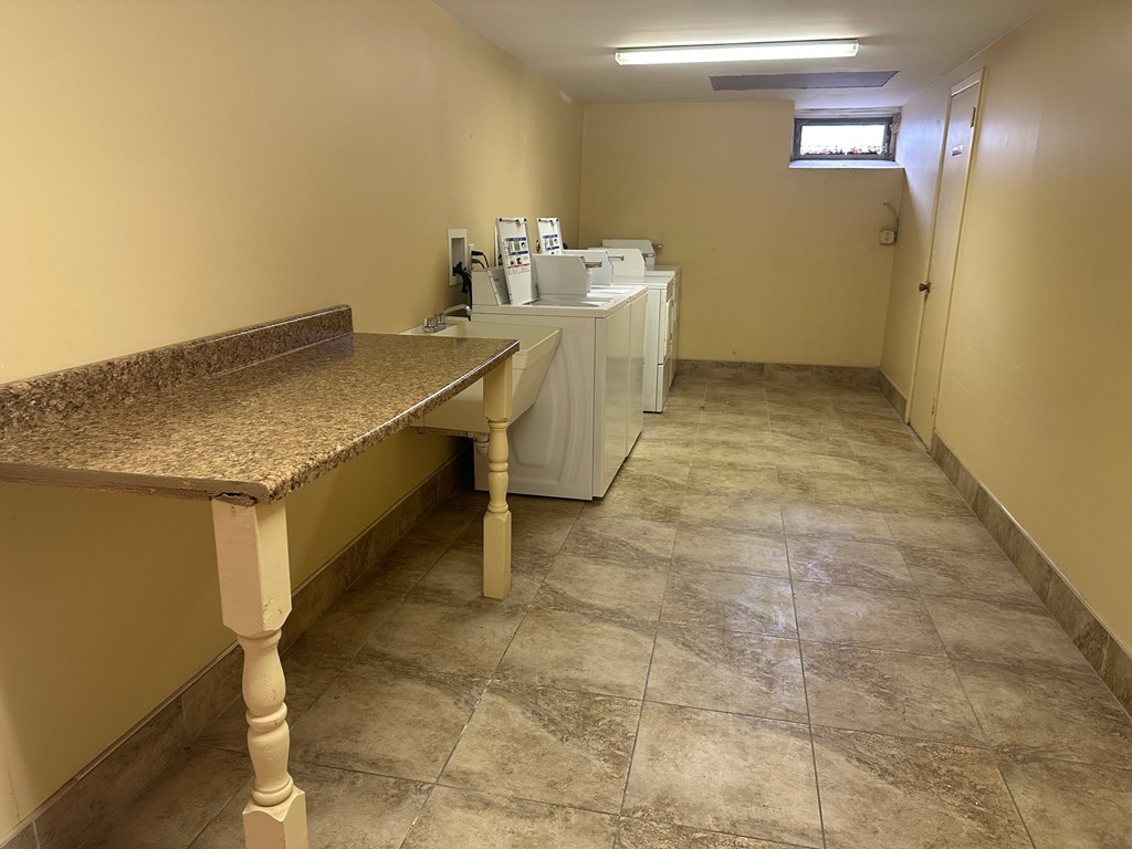 A room with a counter and a window.