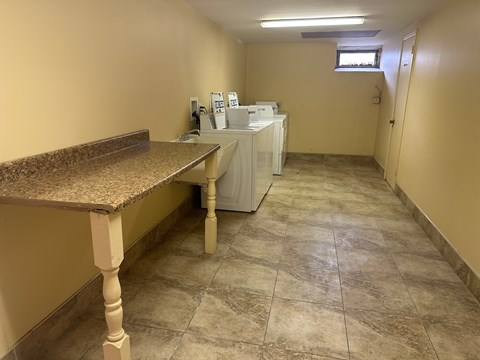 A room with a counter and a window.
