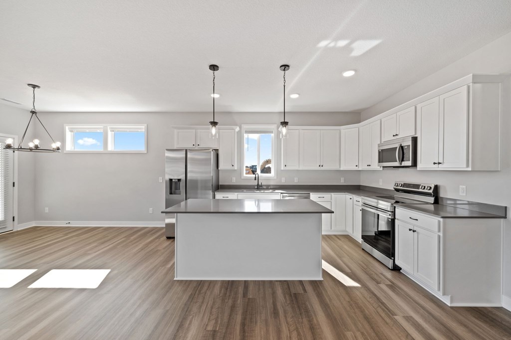 A modern kitchen with a large island in the center.