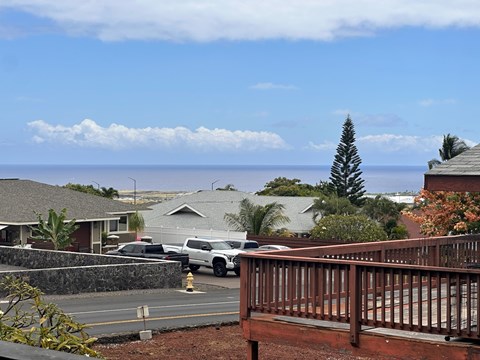 A white car is parked on a street.