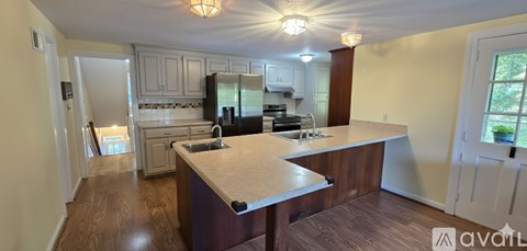 A kitchen with a large island in the middle.