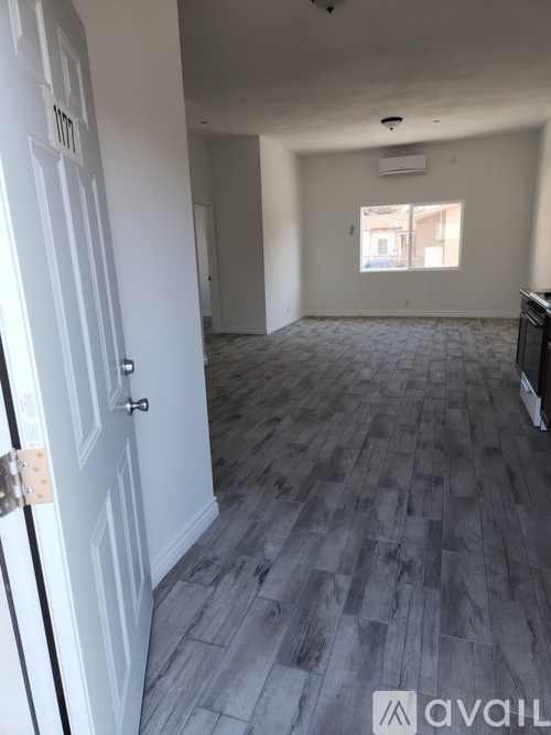 A room with a door and a window.