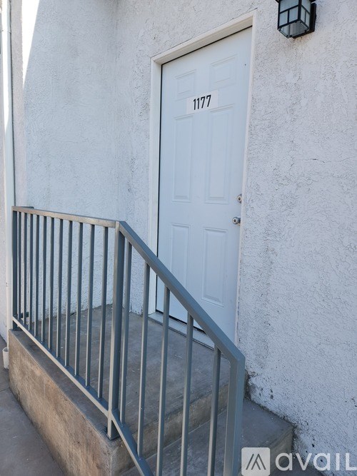 A white door with the number 1177 on it.