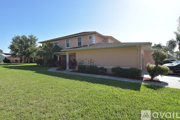 A house with a well-maintained lawn in front.