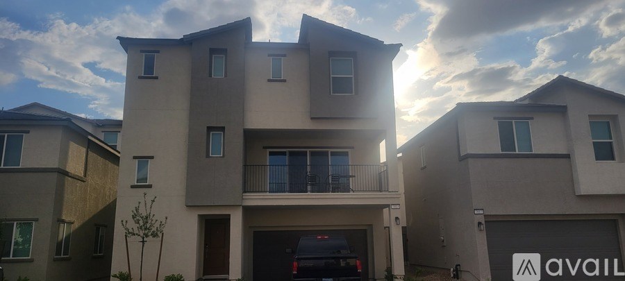A modern two-story house with a garage is for sale.