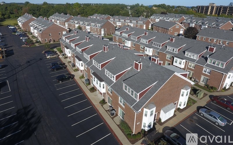 A large apartment complex with multiple buildings and parking lots.
