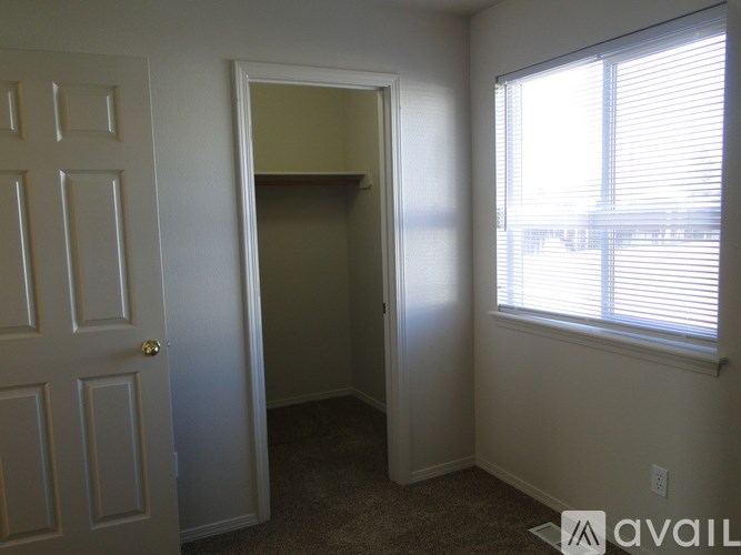 A room with a door and a window.