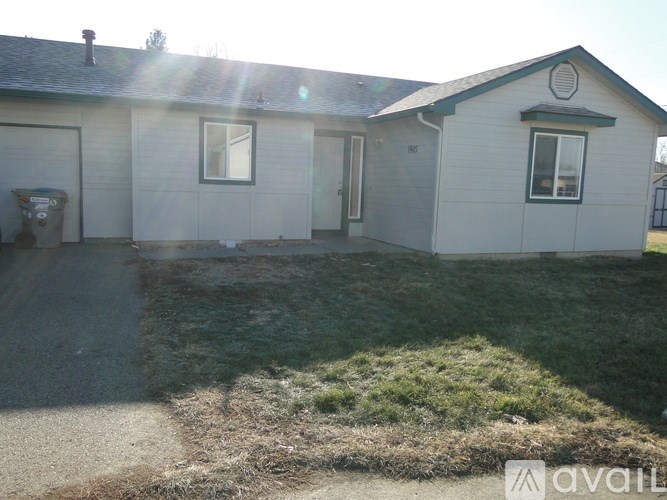 A house with a garage and a driveway.