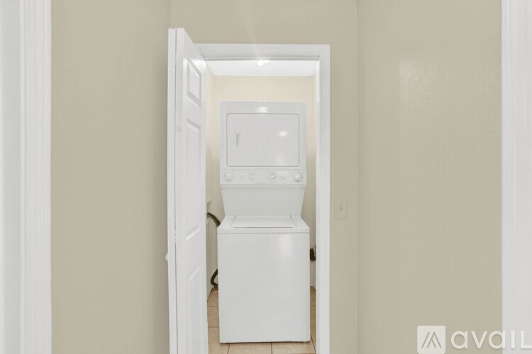 A white toilet is in a small room.