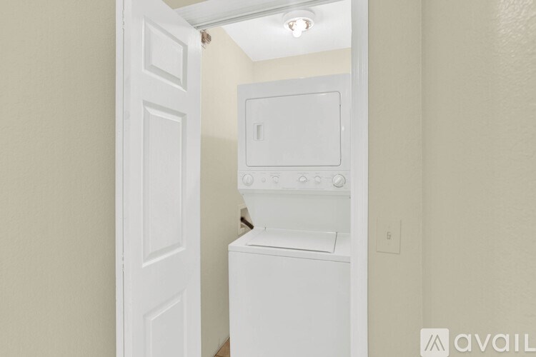 A white oven and microwave in a kitchen.