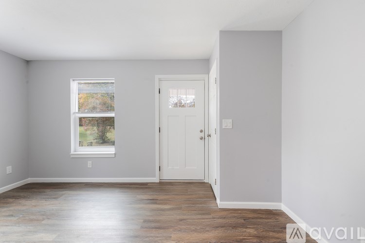 A room with a door and a window.