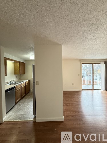 A room with carpeted floor and white walls.