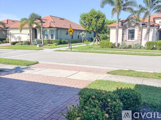 A house with a yellow sign in front of it.