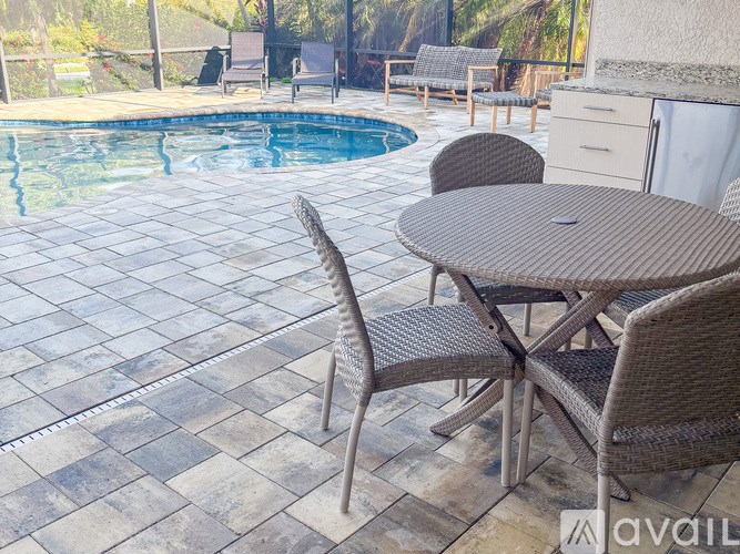 A patio with a table and chairs is shown.