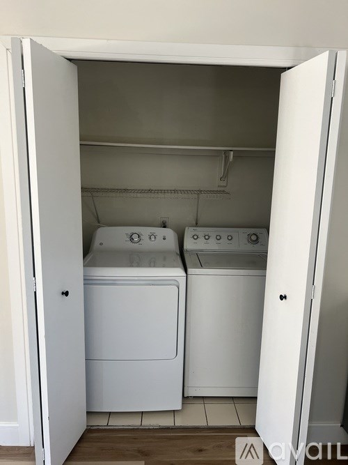 A laundry room with a washer and dryer.