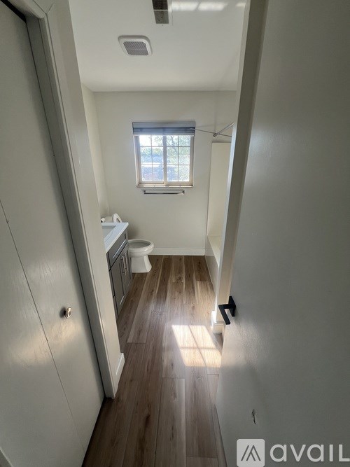 A small bathroom with a toilet and sink.