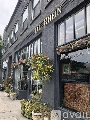 A black building with the words "dr. rhein" on it.