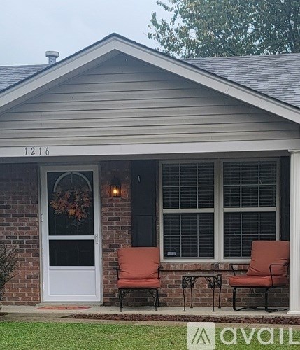 A house with the number 1216 on the front door.