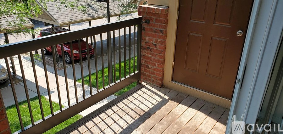 A red car is parked on the street.