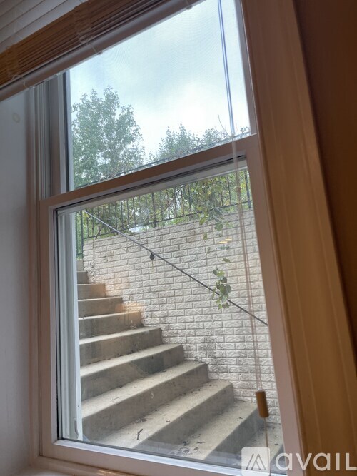 A view of a staircase through a window.