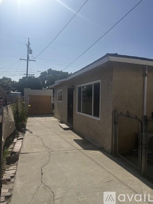 A room with a tiled floor and a window.