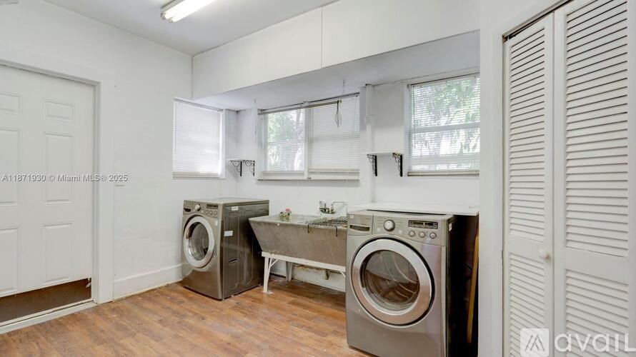 A laundry room with a washer and dryer.