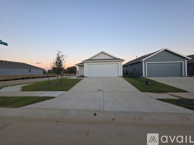 A house with a driveway in front of it is for sale.