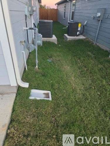A white toilet sits next to a sink in a bathroom.