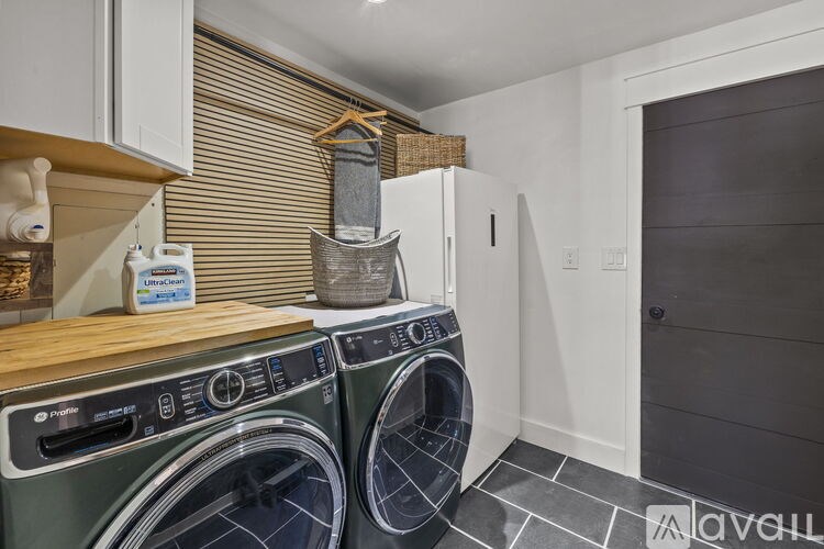 A laundry room with a washer and dryer.