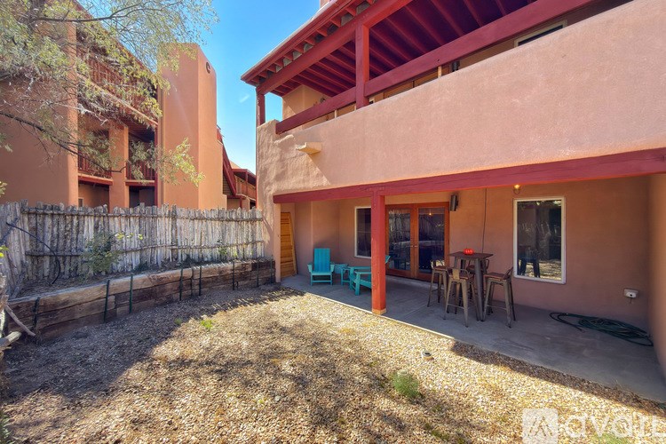 A patio area with a table and chairs is visible.