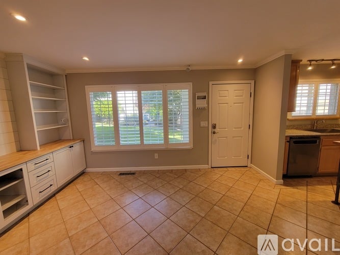 A kitchen with wooden cabinets and stainless steel appliances.