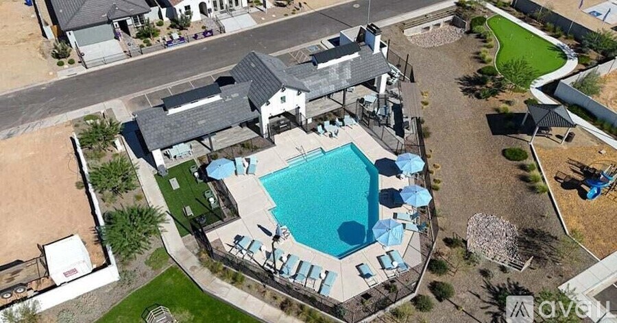 A large house with a pool in the backyard.