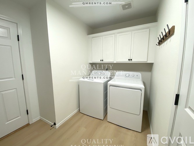 A laundry room with a washer and dryer.