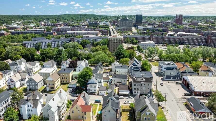 A bird's eye view of a town with buildings of various sizes and shapes.