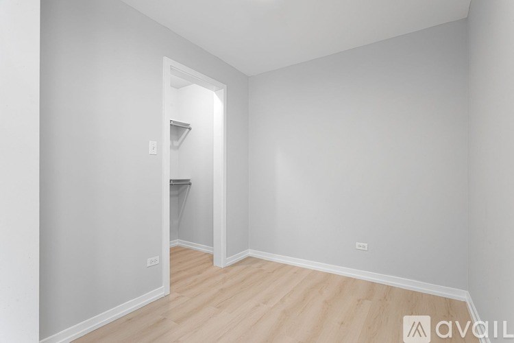 A room with a doorway leading to another room.