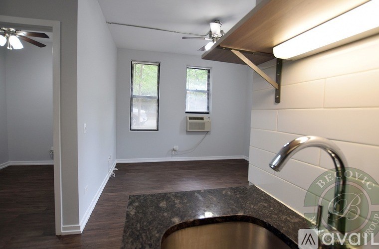 A kitchen with a sink and a window.
