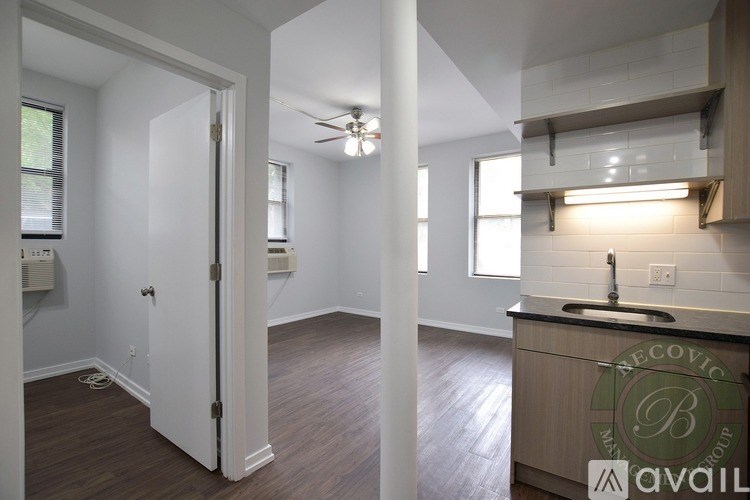 A kitchen with a Recovic brand sink and a logo on the counter.